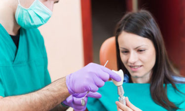 Check the cost of dental implants before getting treated