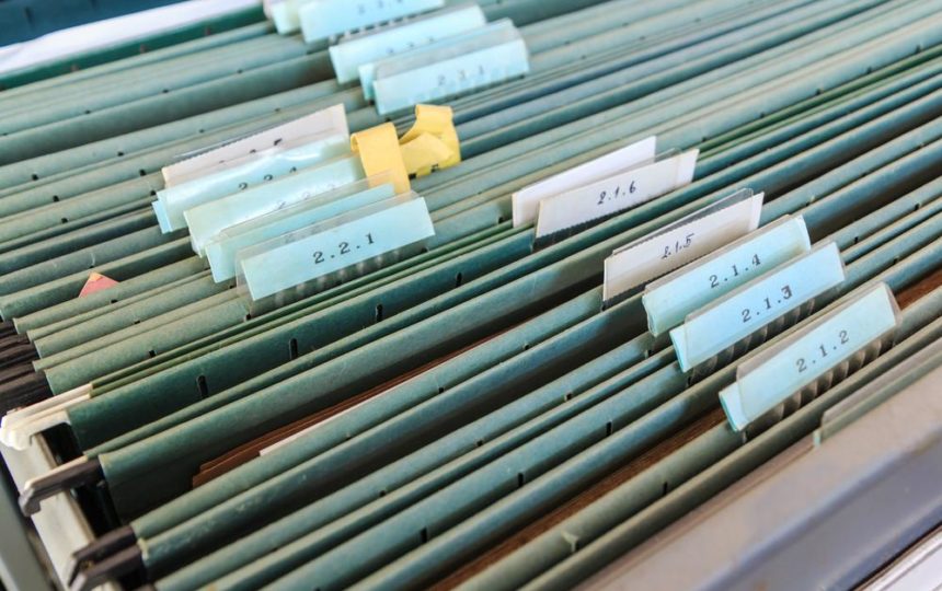 Organize files with filing cabinet