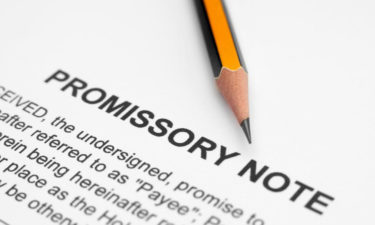 What should be included in a promissory note?